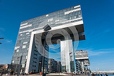 Cologne Koln, Germany: Rheinauhafen, Old Kolner Harbor, with modern Business Building called KranhÃ¤user Editorial Stock Photo