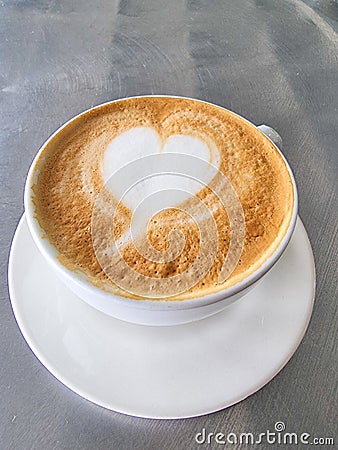 Colombia, Medellin, cup with cappuccino with heart shaped milk foam Stock Photo