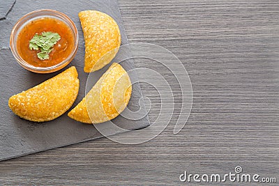 Colombian empanada with spicy sauce Stock Photo