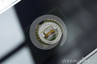 Colombian police smal metallic pin into a showcase Editorial Stock Photo