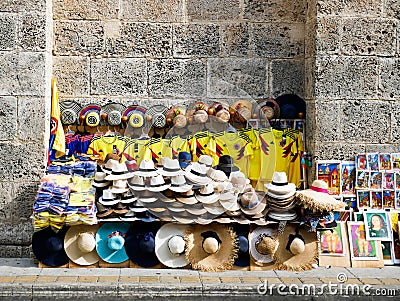 Colombian soccer team shirts for sale on a street of old cartagena colombia with colorful hats and copies of Botero paintings Editorial Stock Photo