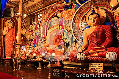 Three Buddha sculptures in Gangaramaya Temple Gangaramaya, Colombo Editorial Stock Photo