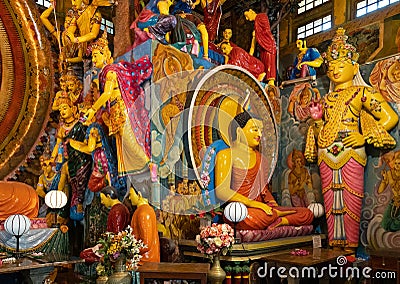 Colombo, Sri Lanka: Gangaramaya Buddhist temple interior with Buddha statue Editorial Stock Photo