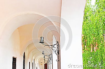 Colonnaded corridor and candlesticks in Palanok Castle, Ukraine Stock Photo