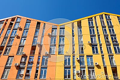 Color facade of a house with lot of air condition units. Stock Photo