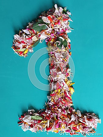 color flower petals forming the number 1 and green backgruound Stock Photo
