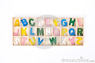 Color painted wooden english alphabet set in wooden box Stock Photo