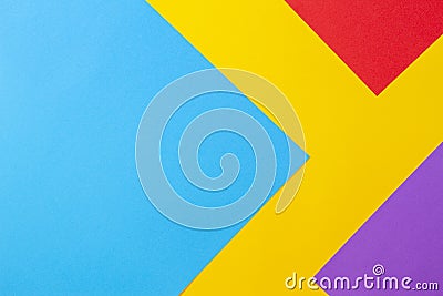 Color papers geometry flat composition background with yellow red blue and purple tones Stock Photo