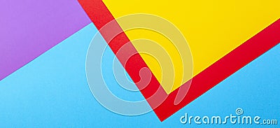 Color papers geometry flat composition background with yellow red violet and blue tones Stock Photo