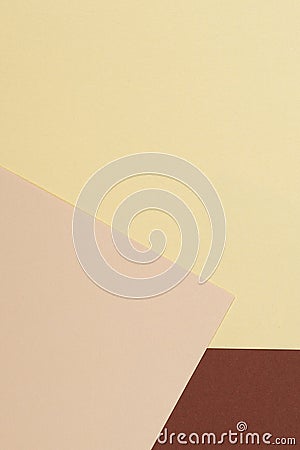 Color papers geometry vertical composition background with yellow beige and brown tones. Neutral earth colored Stock Photo