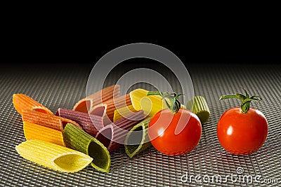 Color pasta with tomatoes Stock Photo