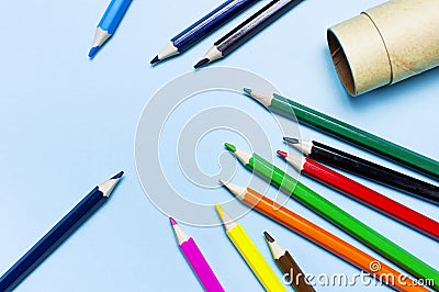 Color pencils on blue background top view flat lay with copy space. Wooden colored pencils for drawing, objects for creativity, Stock Photo