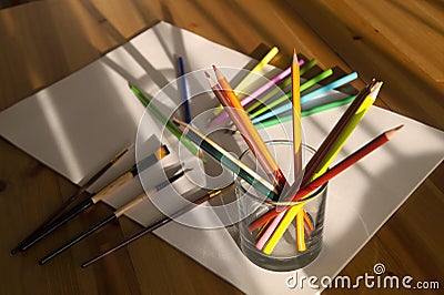 Color pencils and brushes on drawing album Stock Photo