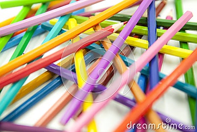 Color pencils disordered in different directions on white background Stock Photo