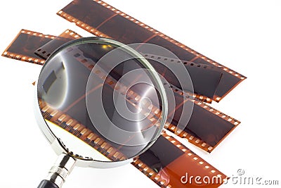 Color photographic film and magnifying glass Stock Photo