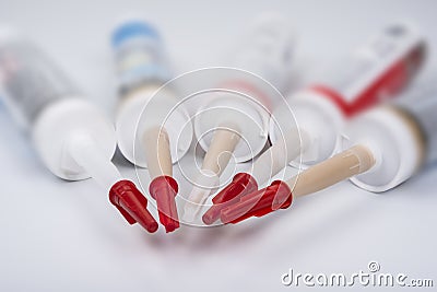 Color sanitary silicone on a white background Stock Photo