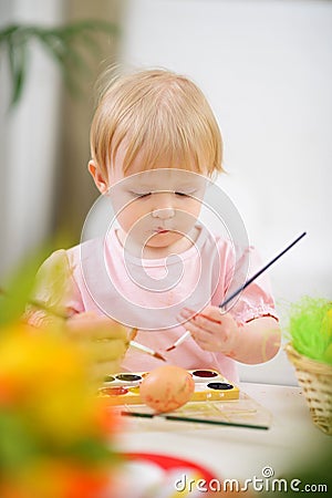 Color smeared baby painting Easter egg Stock Photo