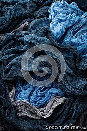 Color texture gauze fabric. Painted hand-made gray, blue and black. Selective focus. Top view. Copy space Stock Photo