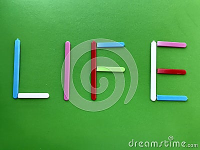 Color word on paper background. School and study. Text.Abstraction. Stock Photo