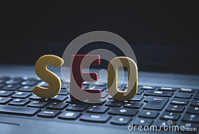 Color word Seo on laptop. Search Engine Optimization Stock Photo