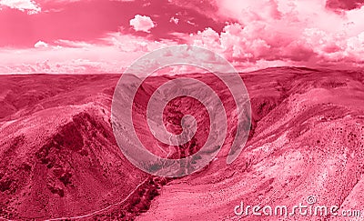 Color of the year 2023: Viva Magenta toned aerial drone view of eroded landform Editorial Stock Photo