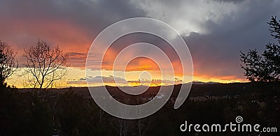 COLORADO colors sky sunset skyline clouds view fire magic Stock Photo