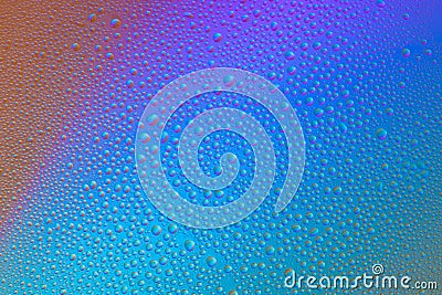 Colored abstract background from drops on glass. Rainbow color transitions Stock Photo