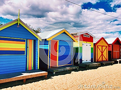 Colored bathing boxes at Brighton beach Stock Photo