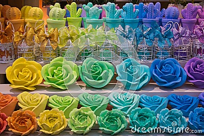 Colored and beautiful rose candles at the christmas market of Ascoli Piceno in Italy Stock Photo