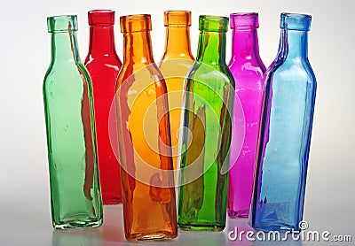 Colored bottles seem to dance. Stock Photo