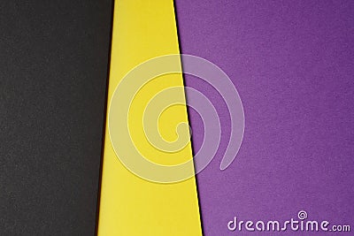 Colored carboards background in black yellow purple tone. Copy s Stock Photo