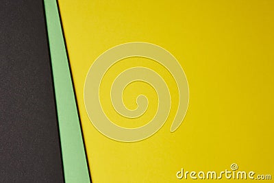 Colored cardboards background in black green yellow tone. Copy s Stock Photo