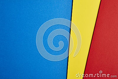 Colored cardboards background in blue yellow red tone. Copy space. Stock Photo
