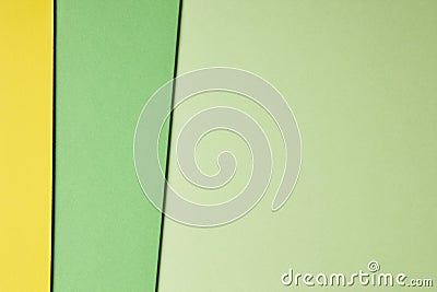 Colored cardboards background in green yellow tone. Copy space Stock Photo