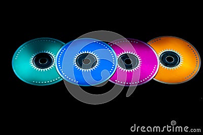 Colored cdrom on black background Stock Photo