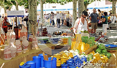 Colored ceramic objects for sale in a craft fair of the patron saint festivities of Zamora. Spain. Editorial Stock Photo