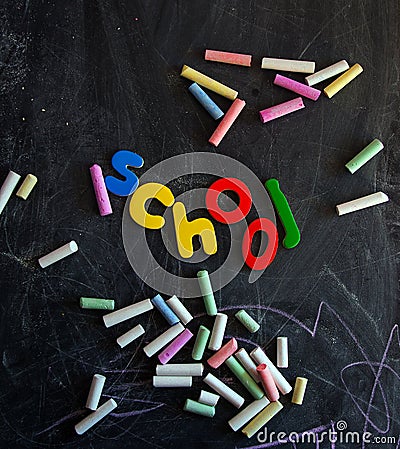 Colored chalks numbers and letters on blackboard Stock Photo