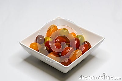 Bowl with Cherry Tomato. Isolated Stock Photo
