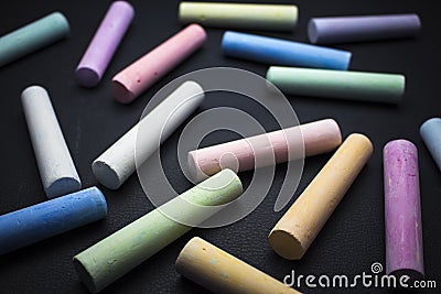 Colored children`s chalk on a black background Stock Photo