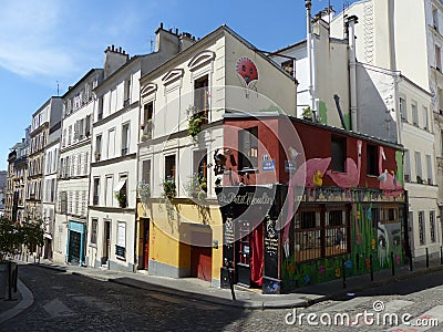 Colored corner of a building in a street of Montmartre in Paris, France. Editorial Stock Photo