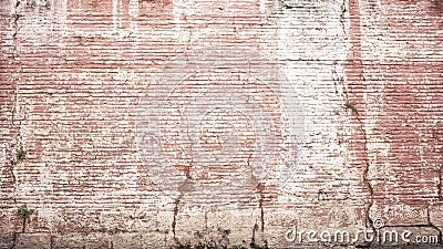 Colored cracked vintage brick wall background Stock Photo