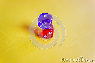 colored dices showing different numbers on yellow background. Free copy space. Concept of game, winning combination. Colored Stock Photo