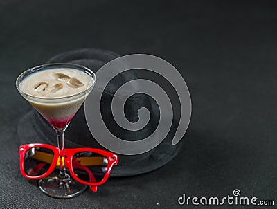 Colored drink, a combination of red, beige and violet, martini g Stock Photo