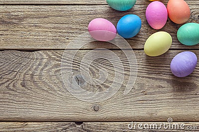 Colored Easter eggs on old wooden background. Stock Photo