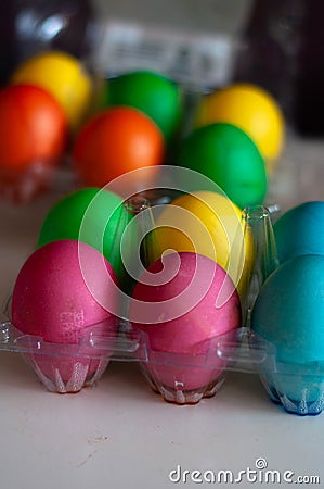 Colored eggs in the egg tray Stock Photo