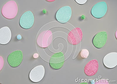 Colored eggs and small fluffy clumps as a symbol of Easter. eggs made of foamira Stock Photo