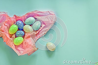Colored eggs and small fluffy clumps as a symbol of Easter. eggs made of foamiran. Stock Photo