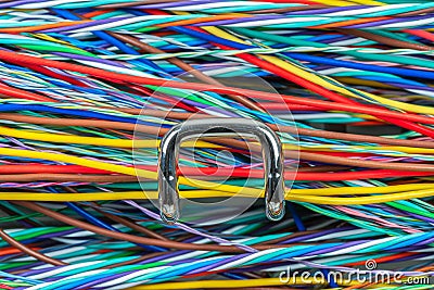 Colored electric cable on hook of organizer Stock Photo