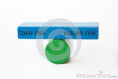 Colored fragments in fragile balance with the words take risk | insure risk Stock Photo