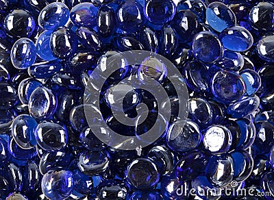 Colored glass gems and polished stones Stock Photo